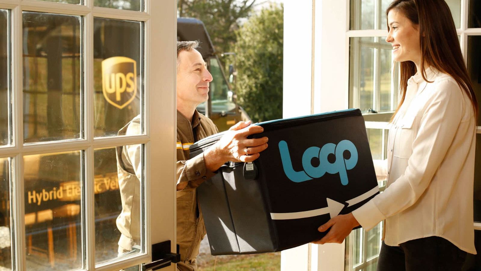 UPS Driver delivers reusable packaging to woman at home